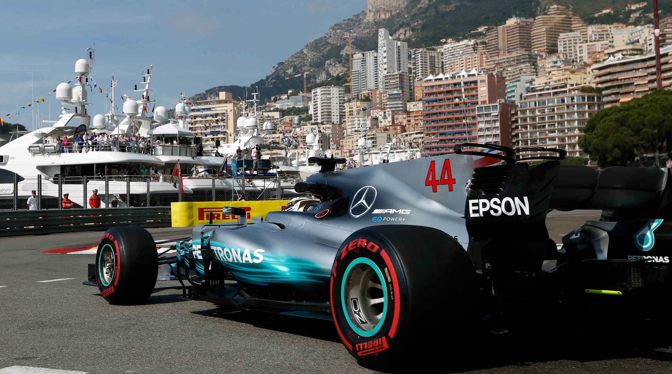 F1 vehicles with Monaco in the background.